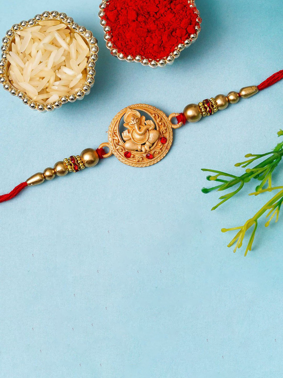 eCraftIndia Artfificial Stones Studded And Beaded Lord Ganesha Rakhi With Roli Chawal