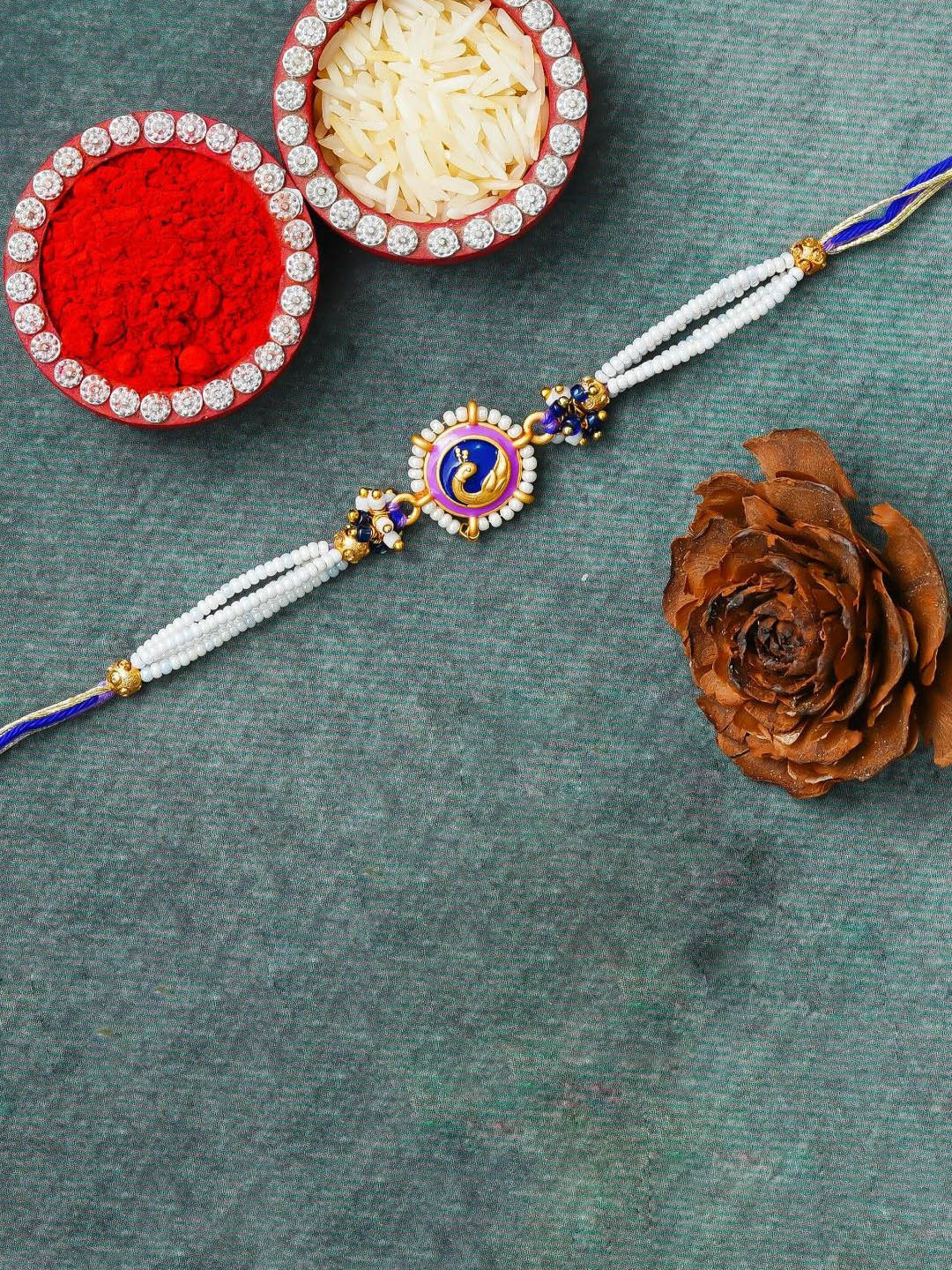 eCraftIndia Artfificial Stones Studded And Beaded Peacock Rakhi With Roli Chawal