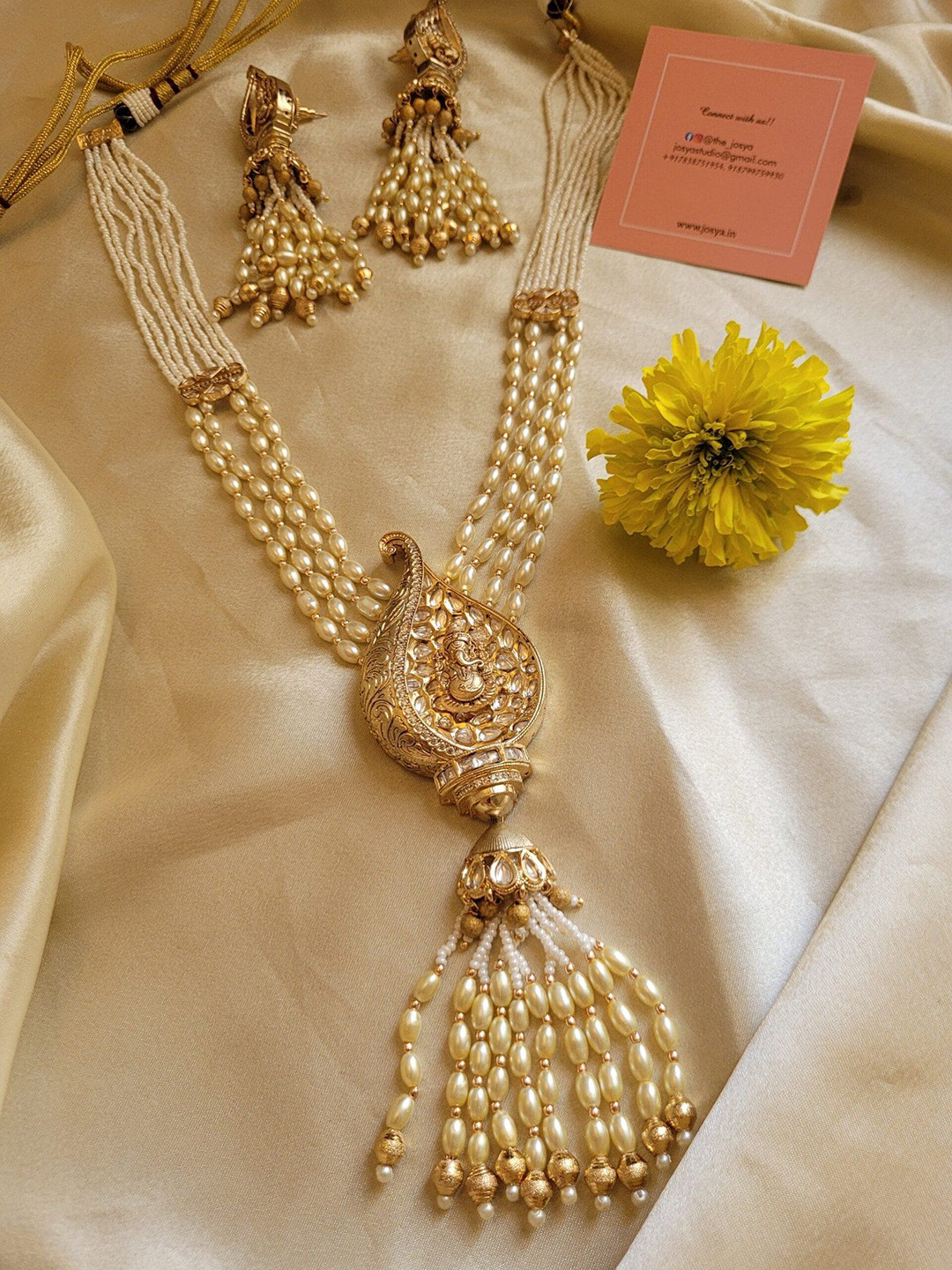 JOSYA Gold-Plated Stone Studded & Pearl Beaded Ganesh Ji Motif Jewellery Set