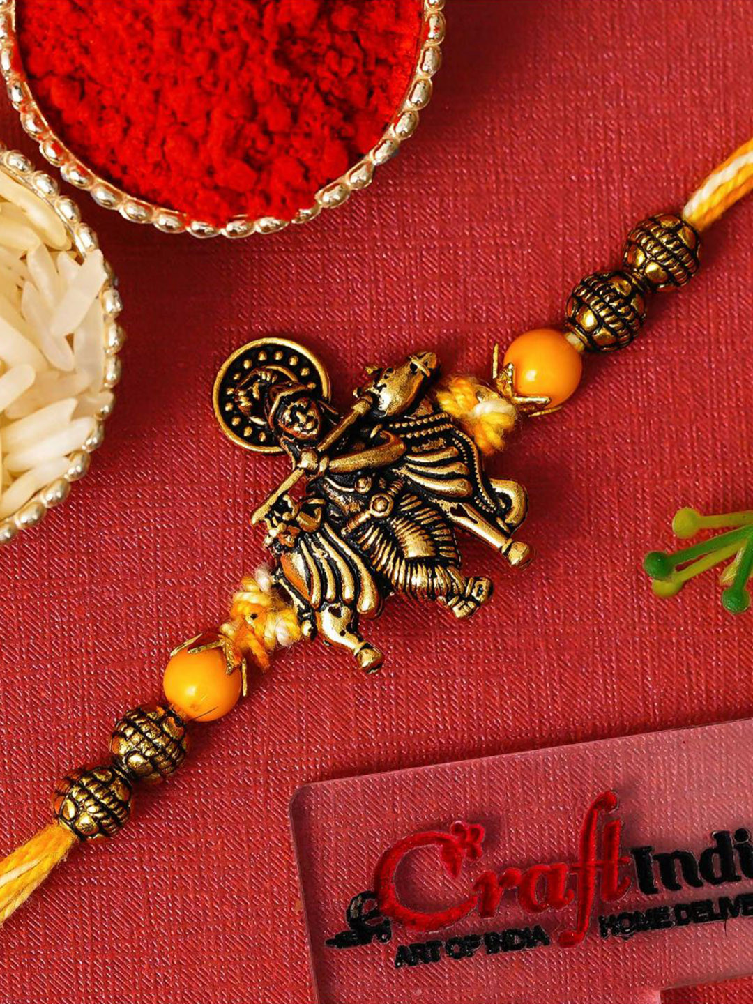eCraftIndia Artfificial Stones Studded And Beaded Krishna Rakhi With Roli Chawal