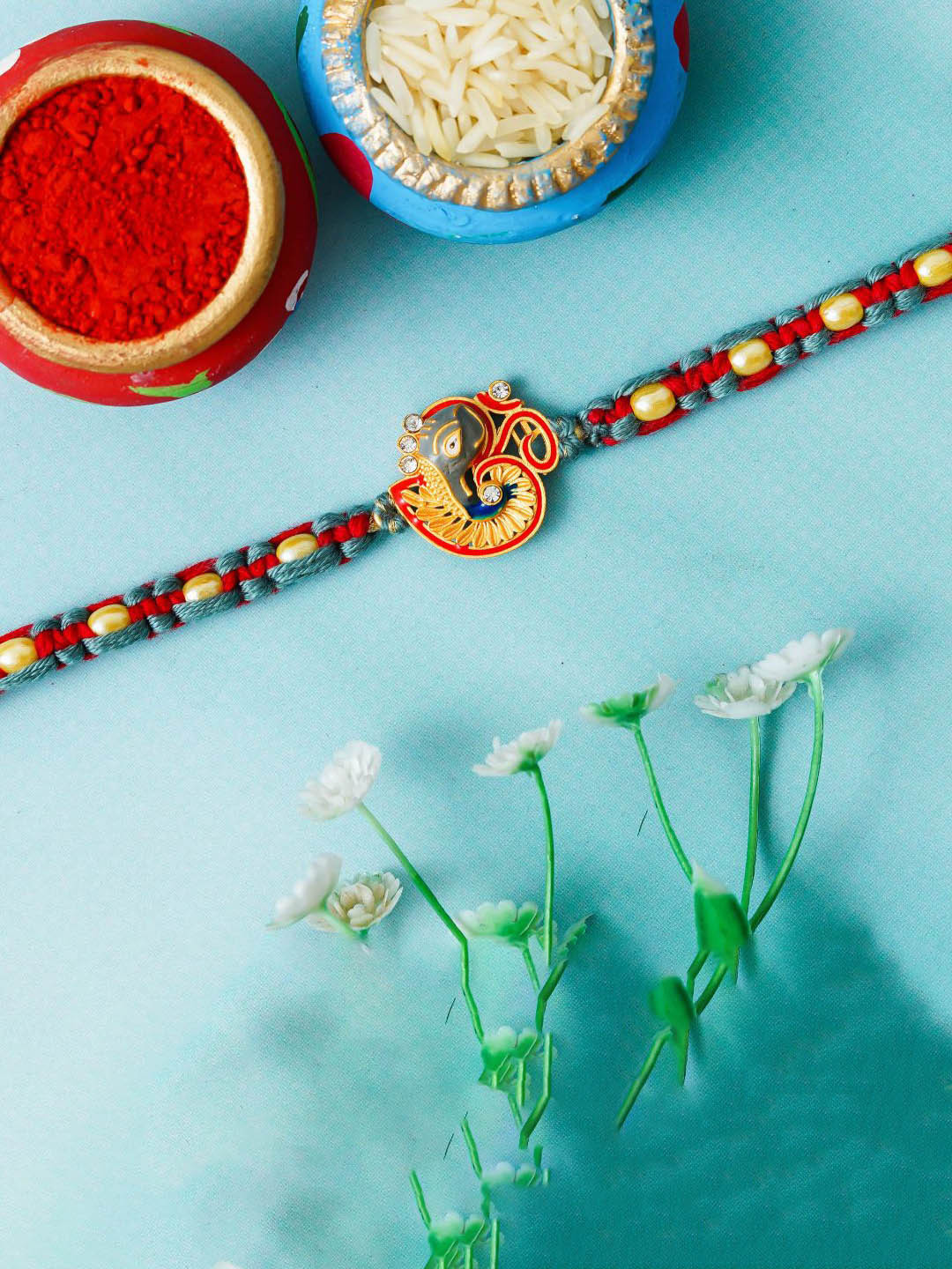 eCraftIndia Stones Studded & Beaded Lord Ganesha Om Design Thread Rakhi