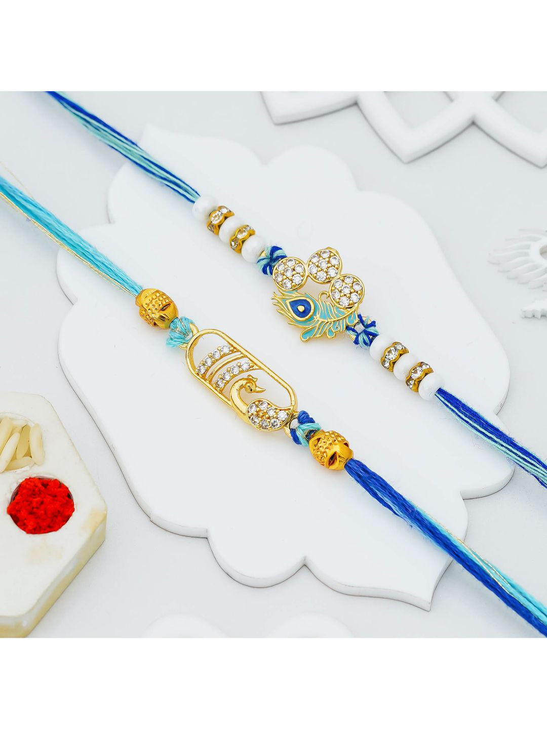 eCraftIndia Set of 2 Diamond Stone Studded & Beaded Peacock Feather Thread Rakhis