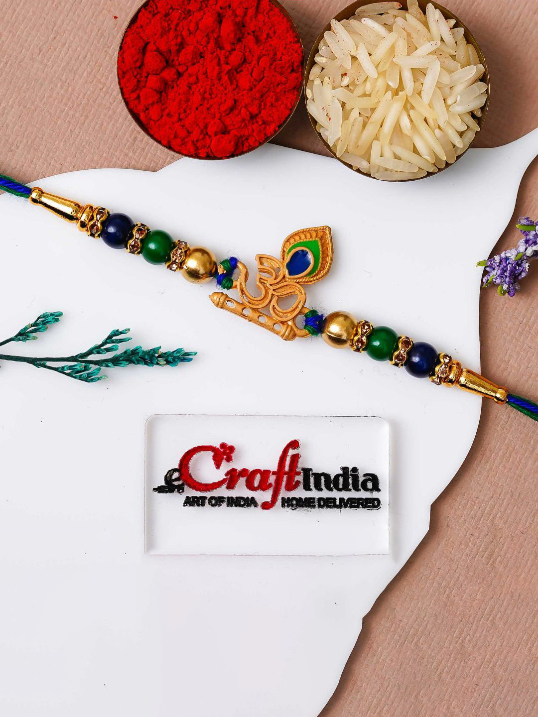eCraftIndia Peacock Feather Om Rakhi For Brother