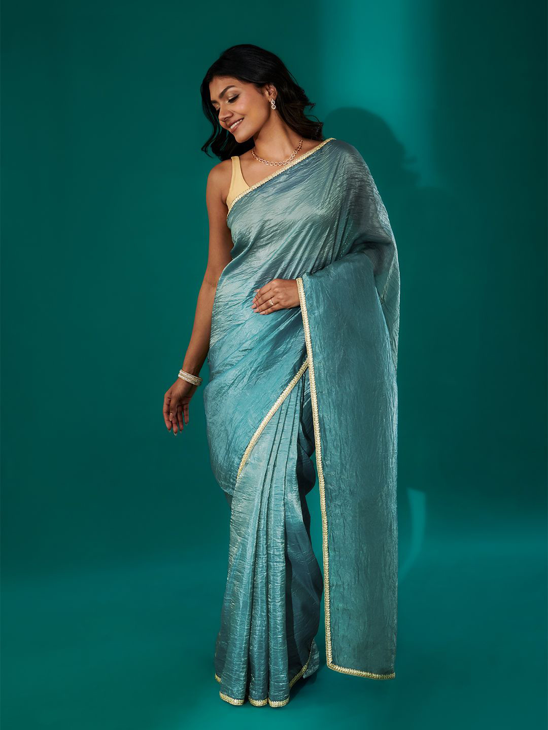 TEEJH Teertha Teal Shimmer Tissue Saree