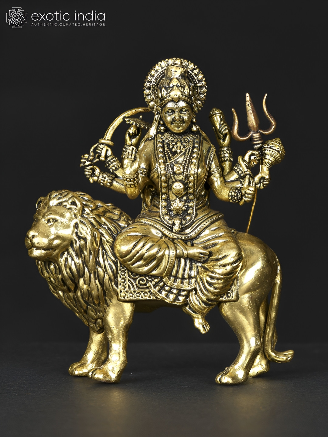 Exotic India Four-Armed Maa Sherawali Gold Brass Metallic Prayer Room Tiny Showpiece - 3.3 Inches