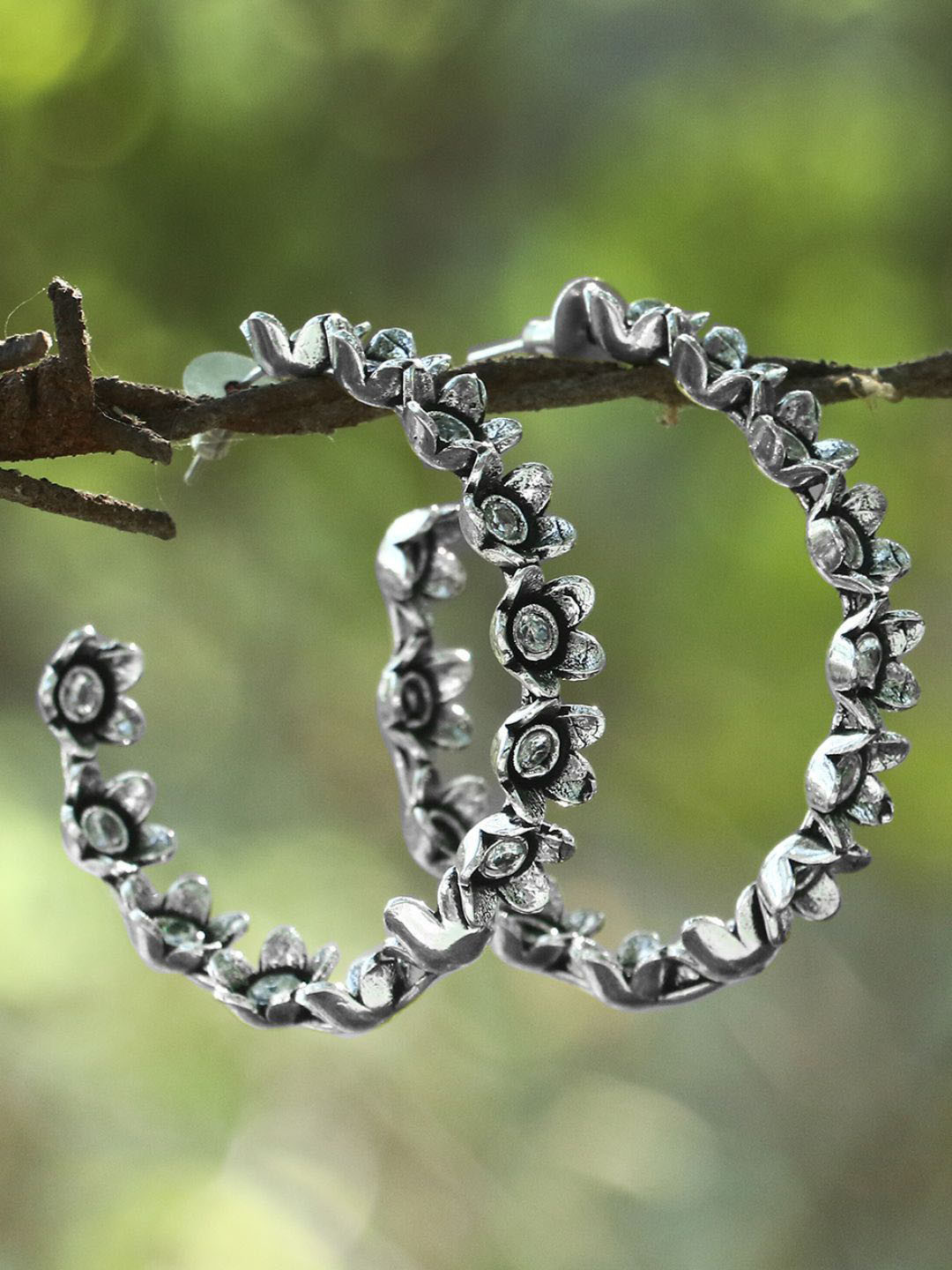 Sangria Silver-Plated Stones-Studded Flower Shaped Oxidised Half Hoop Earrings