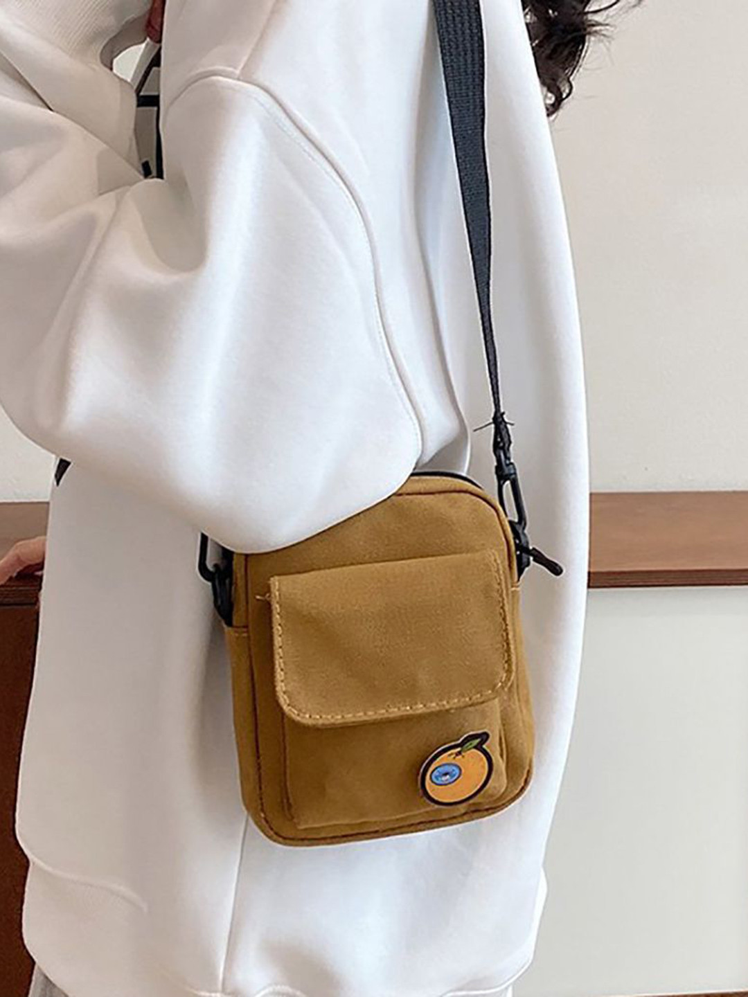 StyleCast x Revolte Sling Bag