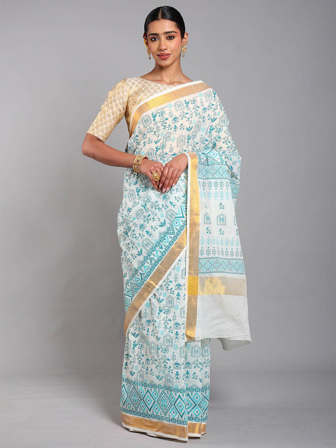 Exotic India Cannoli-Cream Warli Folk Art Motifs Cotton Saree with Golden Border