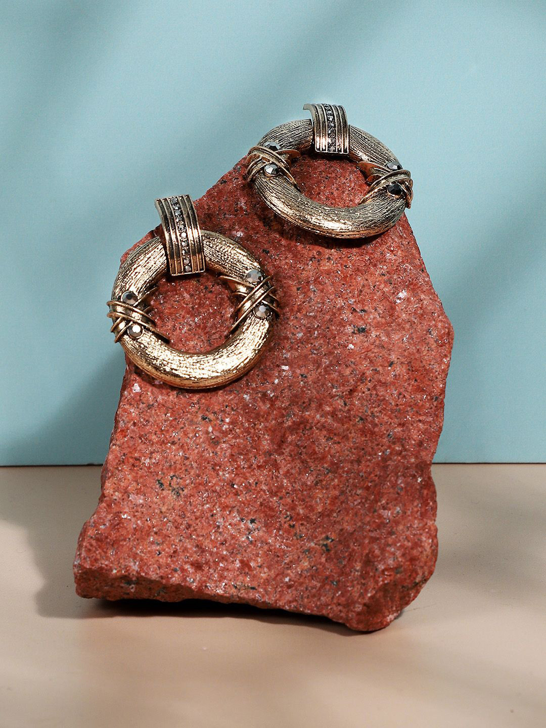 DressBerry Gold-Plated Artificial Stones Studded Circular Shaped Textured Drop Earrings