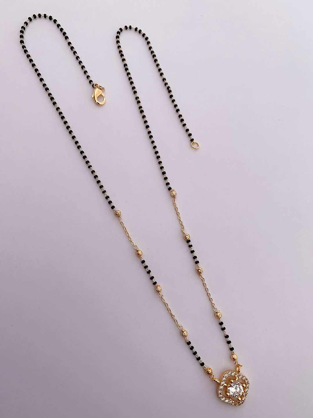 BELLEZA JEWELS Gold-Plated AD Stones Studded & Beaded Mangalsutra