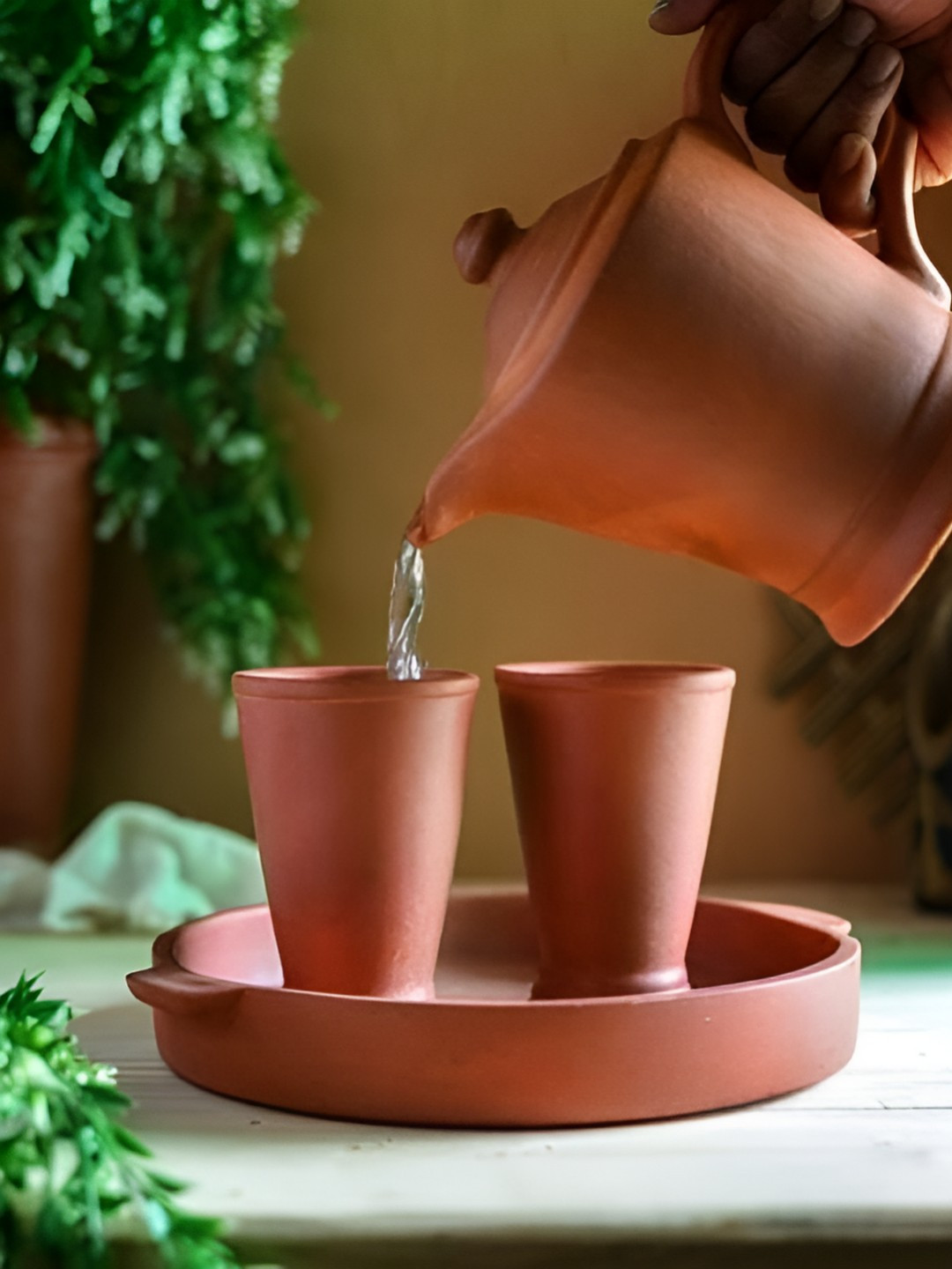 The handicraftian Orange Colored 4 Pieces Terracotta Jug With Glass & Tray