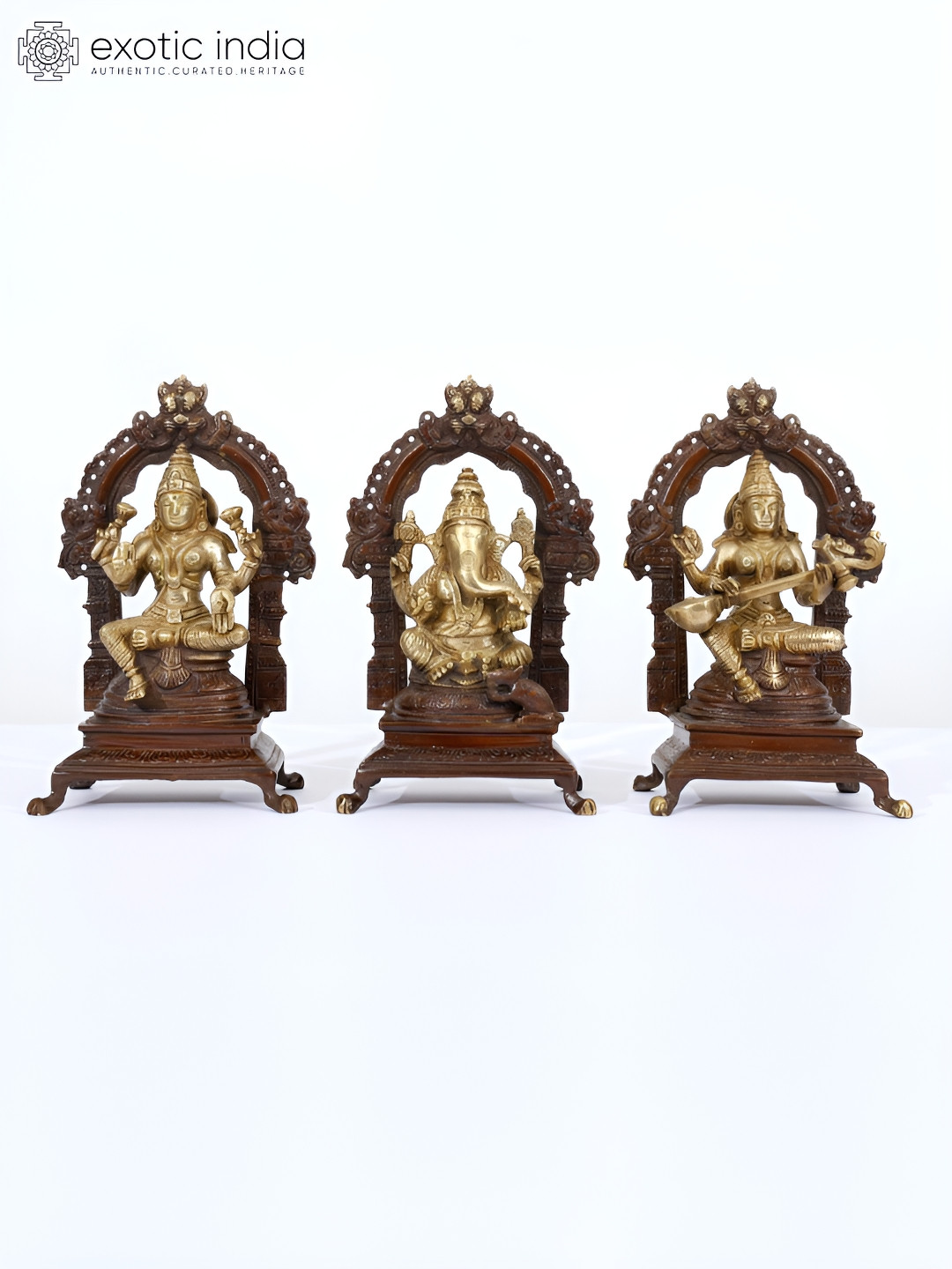 Exotic India Laxmi Ganesha Saraswati Gold Brass Metallic Prayer Room Set of 3 Small Showpieces - 8 Inches