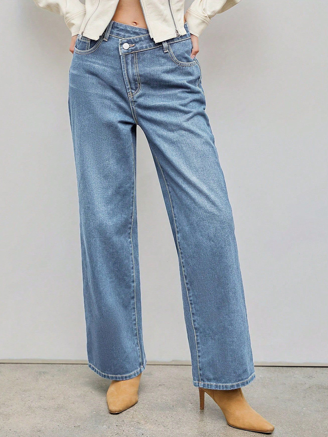 bebe Light Wash Relaxed Fit Jeans with Asymmetrical Waist