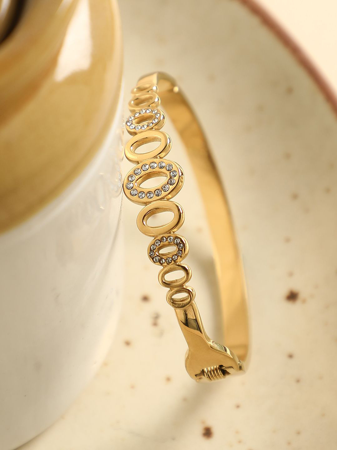 SOHI California Women Gold-Plated Stone Studded The Cyelle Bangle-Style Bracelet