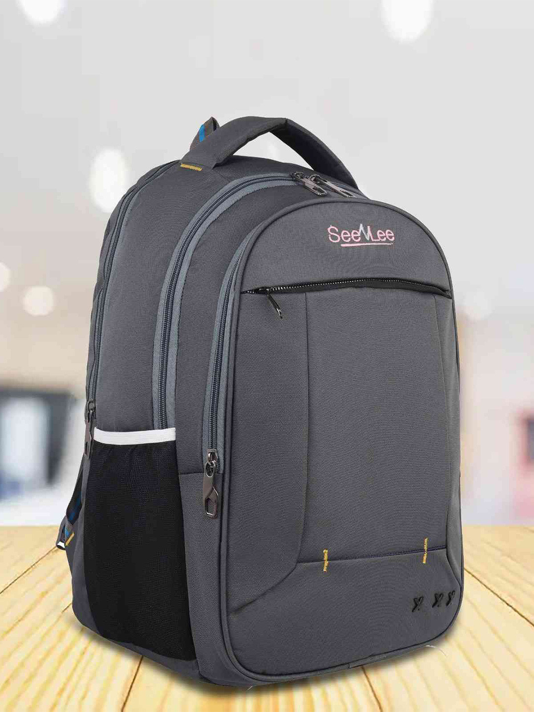 SeeNlee MetroFlex Backpack with laptop sleeve & water-repellent fabric.