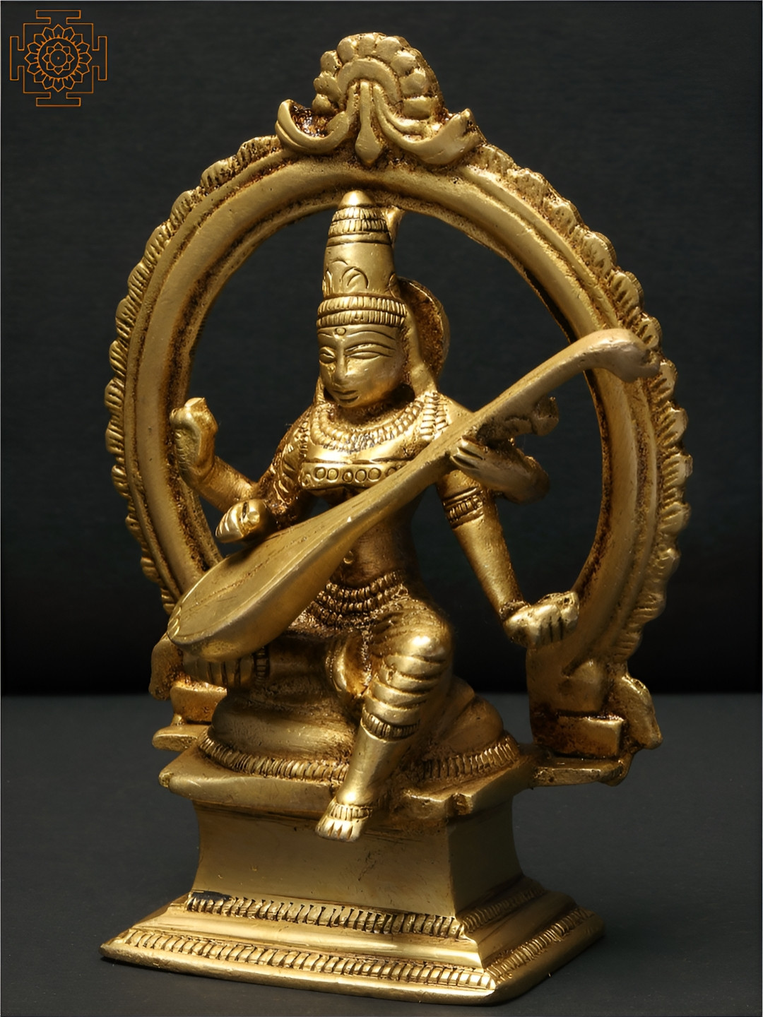 Exotic India Sitting Devi Saraswati with Arch Gold Brass Metallic Prayer Room Medium Showpiece - 4.3 Inches