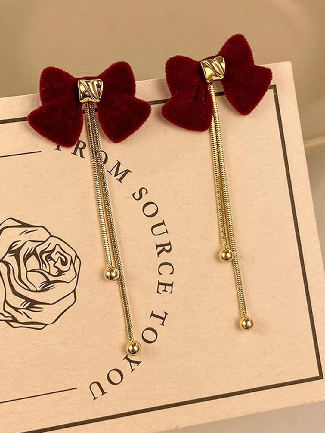 Krelin Gold-Plated Dangling Chains Bow Shaped Drop Earrings