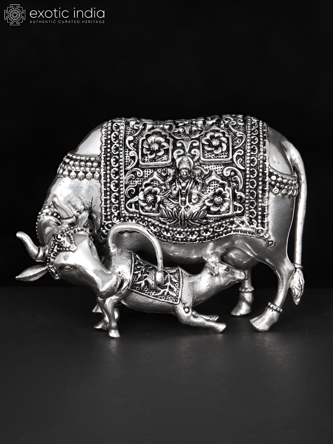 Exotic India Cow and Calf with Lakshmi and Ganesha Carving Silver Brass Metallic Prayer Room Medium Showpiece - 3 Inches