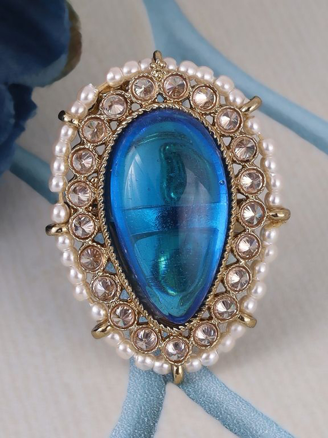 SALONI FASHION JEWELLER Oval Shape Blue Stone Gold Plated Adjustable Ring