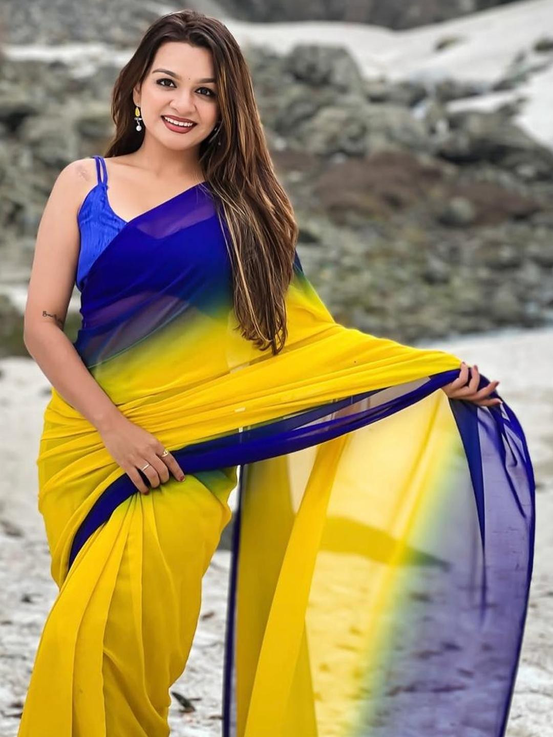 HERE&NOW Women Blue And Yellow Solid Georgette Saree with Border With Satin Blouse