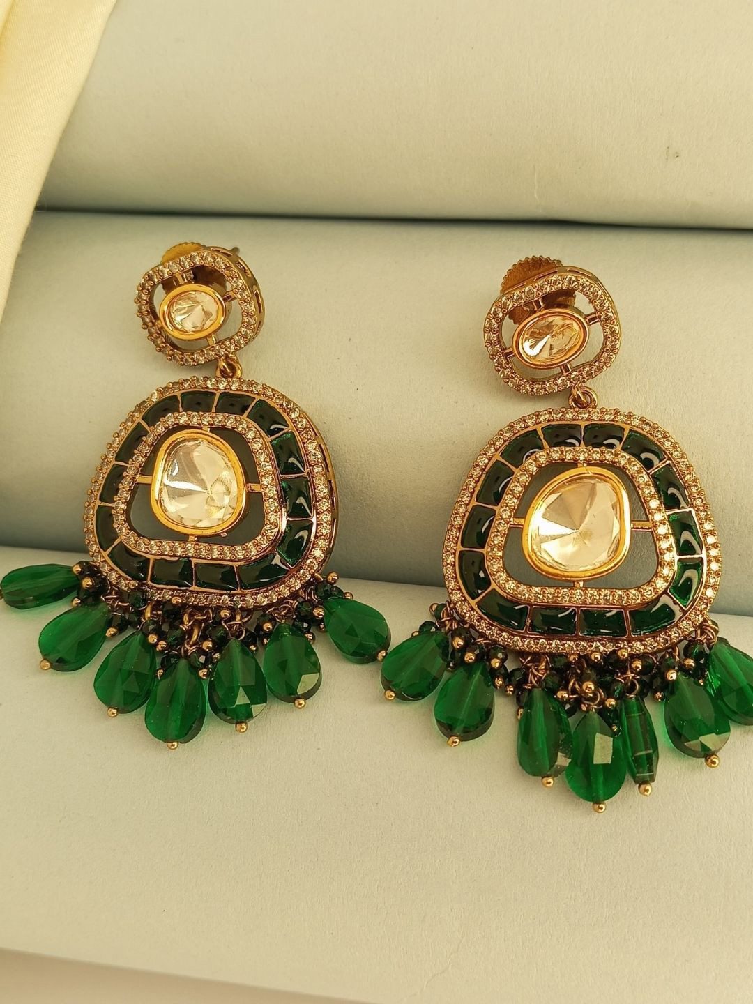 IKSAVA Gold-Plated Emerald Studded And Artificial Beaded Oval Shaped Drop Earrings