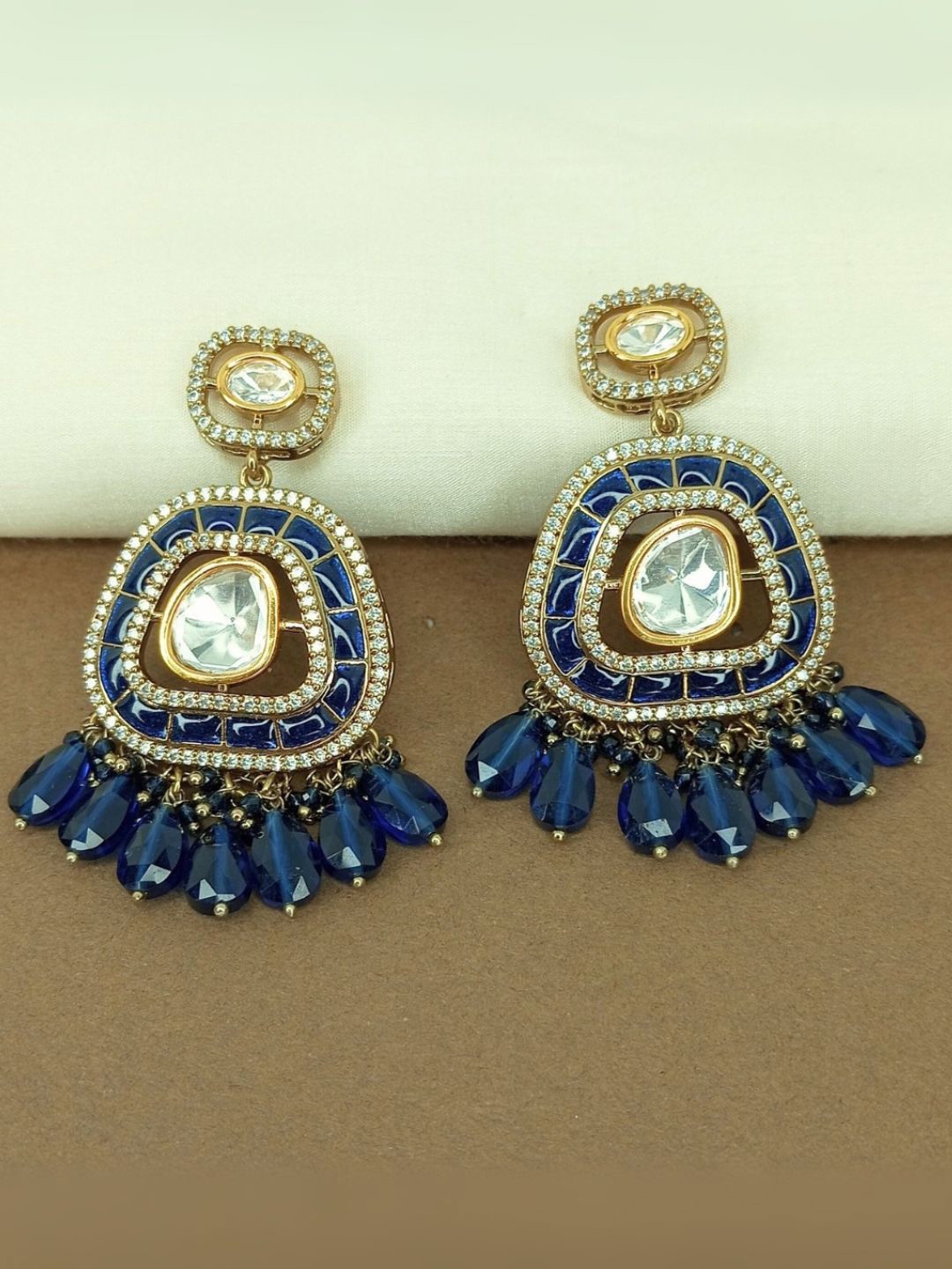 IKSAVA Gold-Plated Sapphire Studded And Artificial Beaded Oval Shaped Drop Earrings