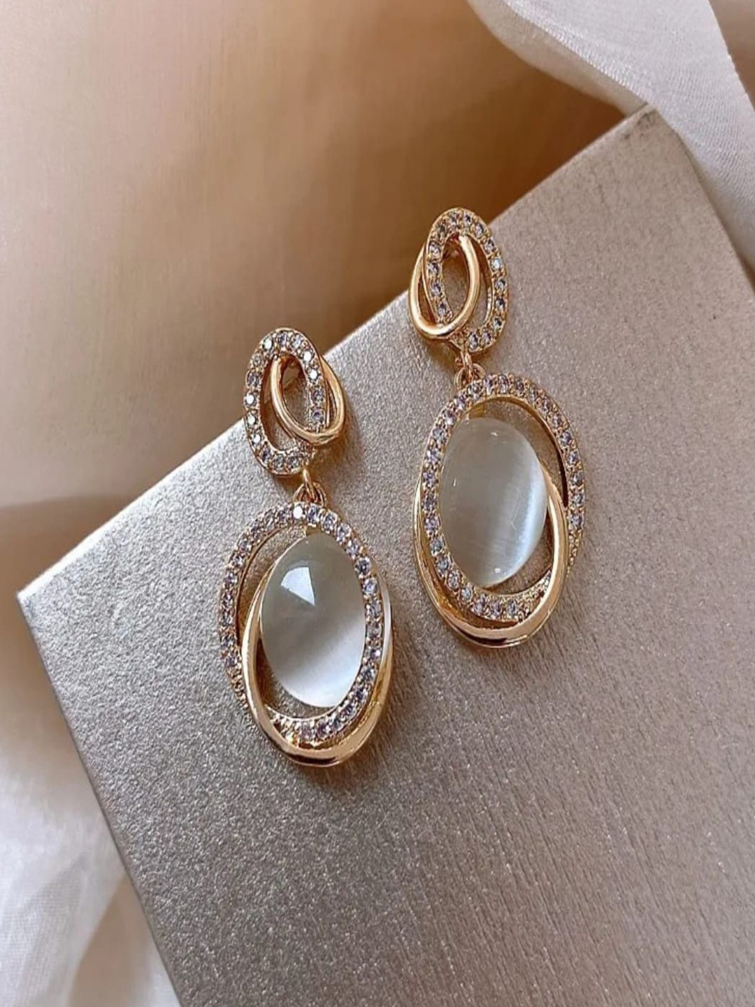 ROYAL NEEDS Korean Artificial Stones Studded Oval Drop Earrings