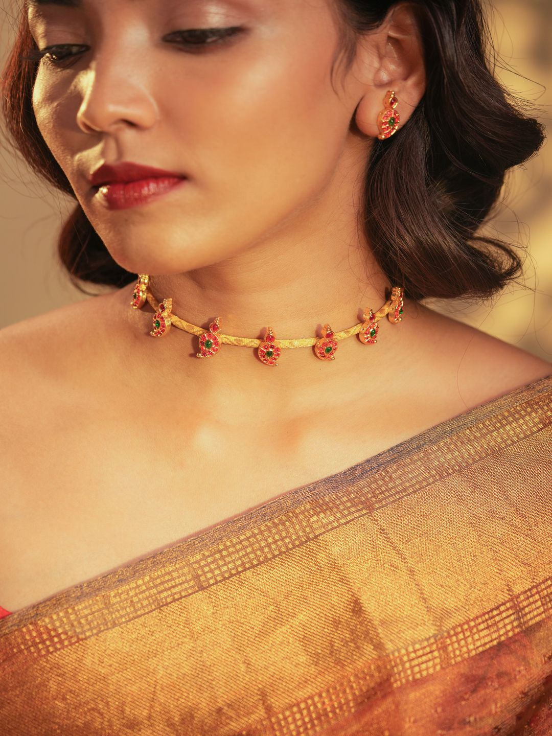 Aarika Women Brass Hasli Paisly Motifs Gold-Plated Necklace