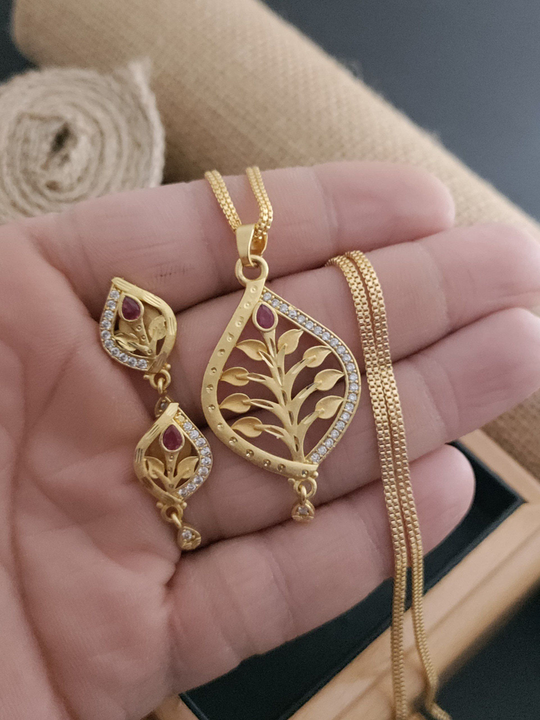 OM KRISHIV COLLECTION Gold-Plated Artificial Stones Studded Leaf Design Jewellery Set