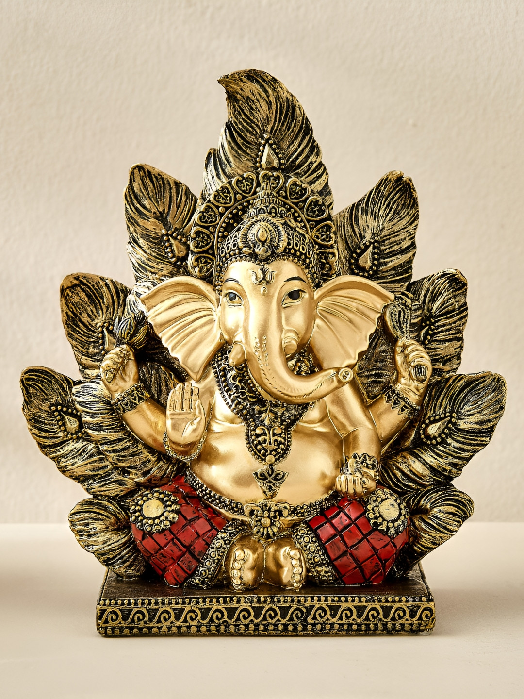 Home Centre Ganesha With Leaf Backdrop Gold-Toned Religious Figurine Showpiece