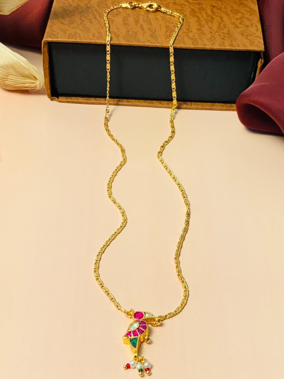 Anouk Women Brass Gold-Plated Stone-Studded Bird Pendant Necklace