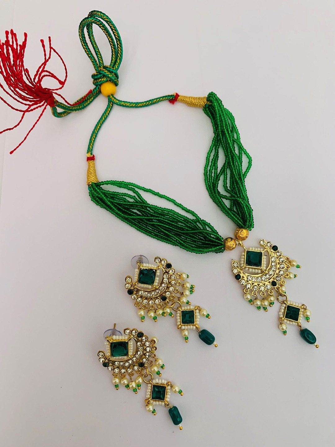 Maruti Rajasthan Gold Plated Artificial Stones Studded And Beaded Necklace and Earrings