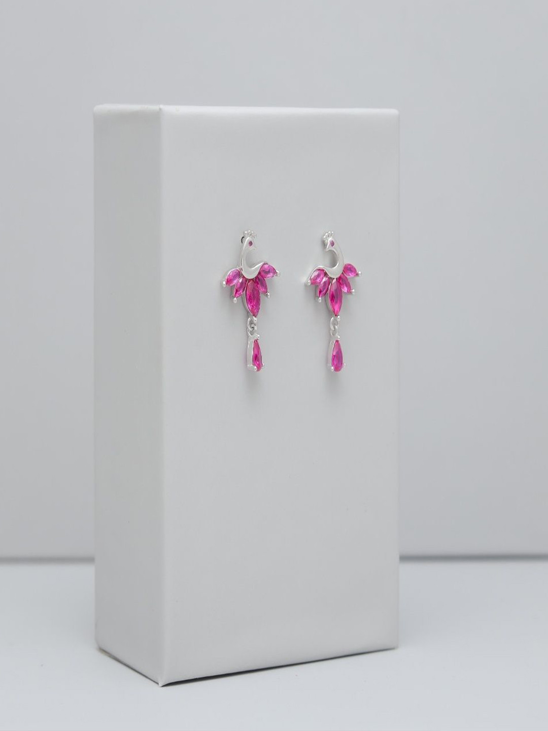 TASSYA Silver-Plated Artificial Stones Studded Peacock Shaped Drop Earrings