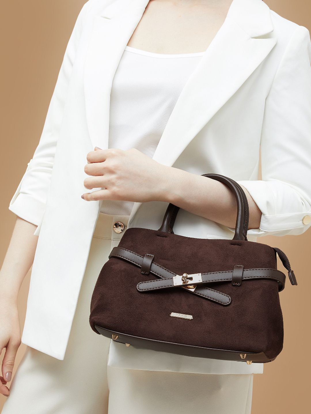 CODE by Lifestyle Women Solid Structured Fringed Handheld Bag