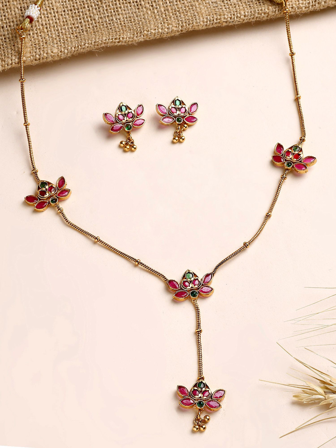 KARATCART Gold-Plated Red and Green Stone Lotus Necklace & Earrings Jewellery Set