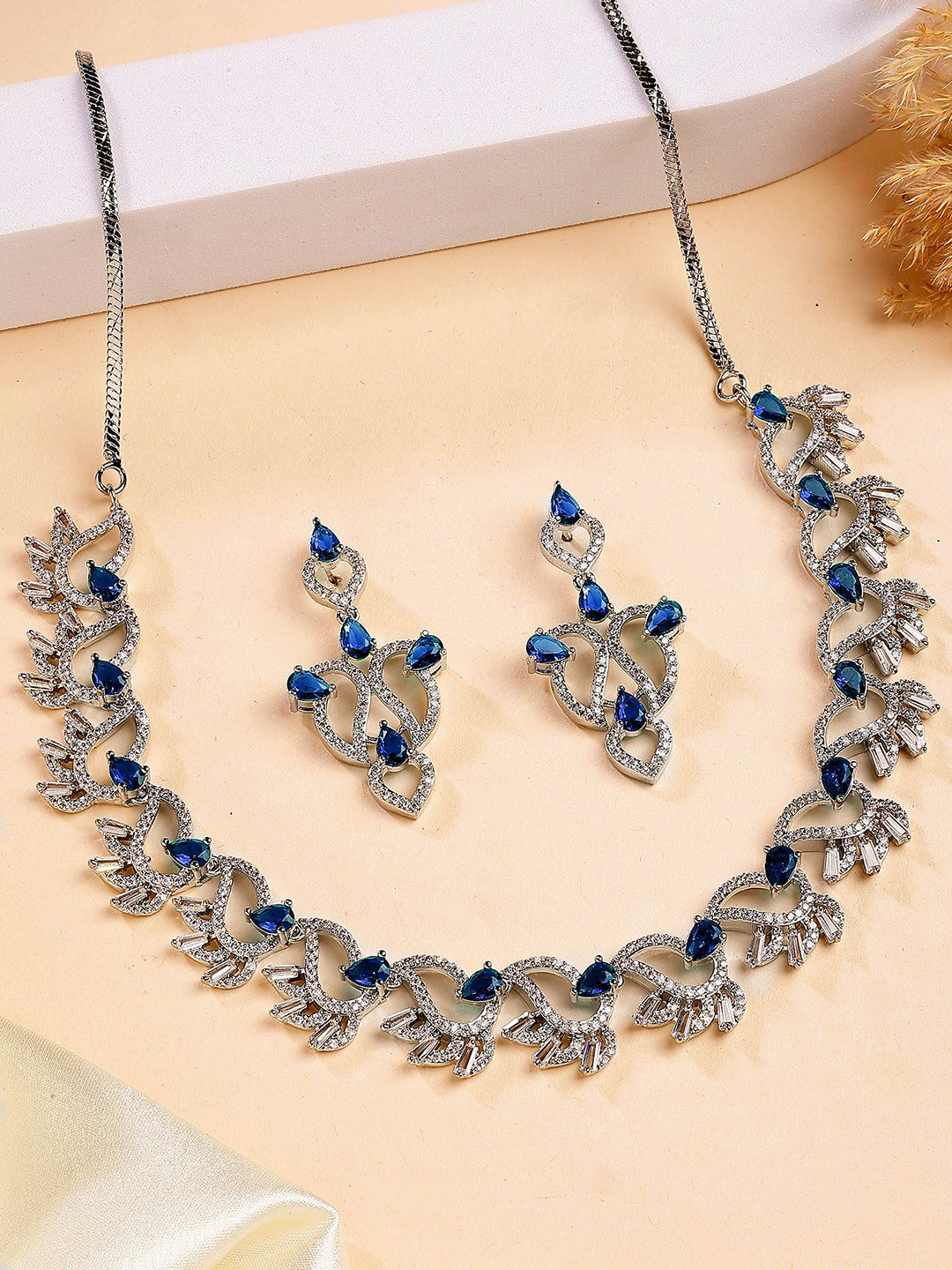 KARATCART Silver-Plated Leaf Motif American Diamond Studded Necklace With Earring Set