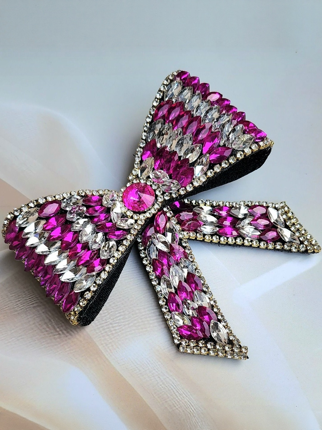DIVASTRI Women Magenta & White Crystal Embellished Bow Hair Clip