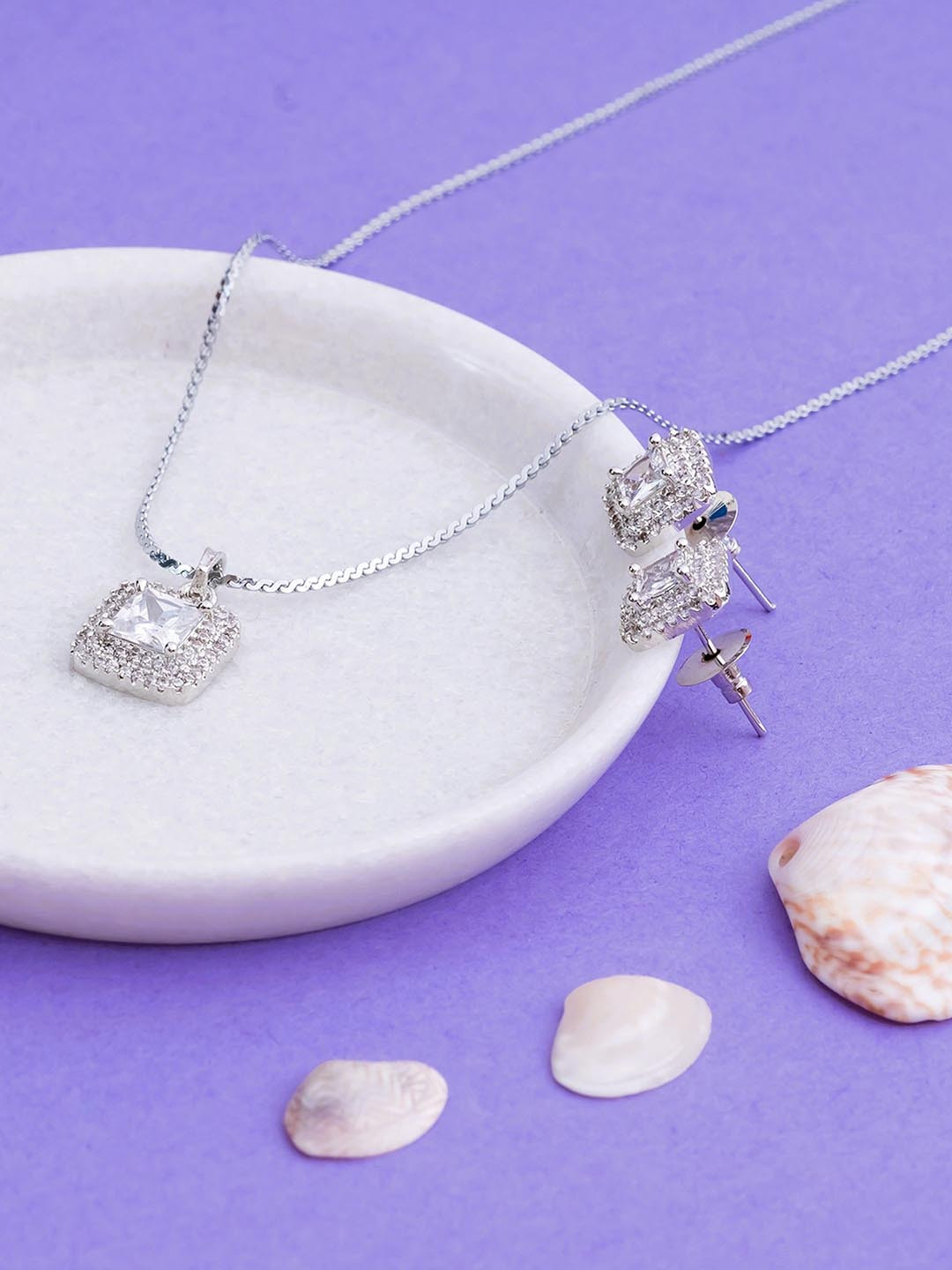 Manikya Rhodium Plated American Diamond Studded Pendant And Earrings With Finger Ring