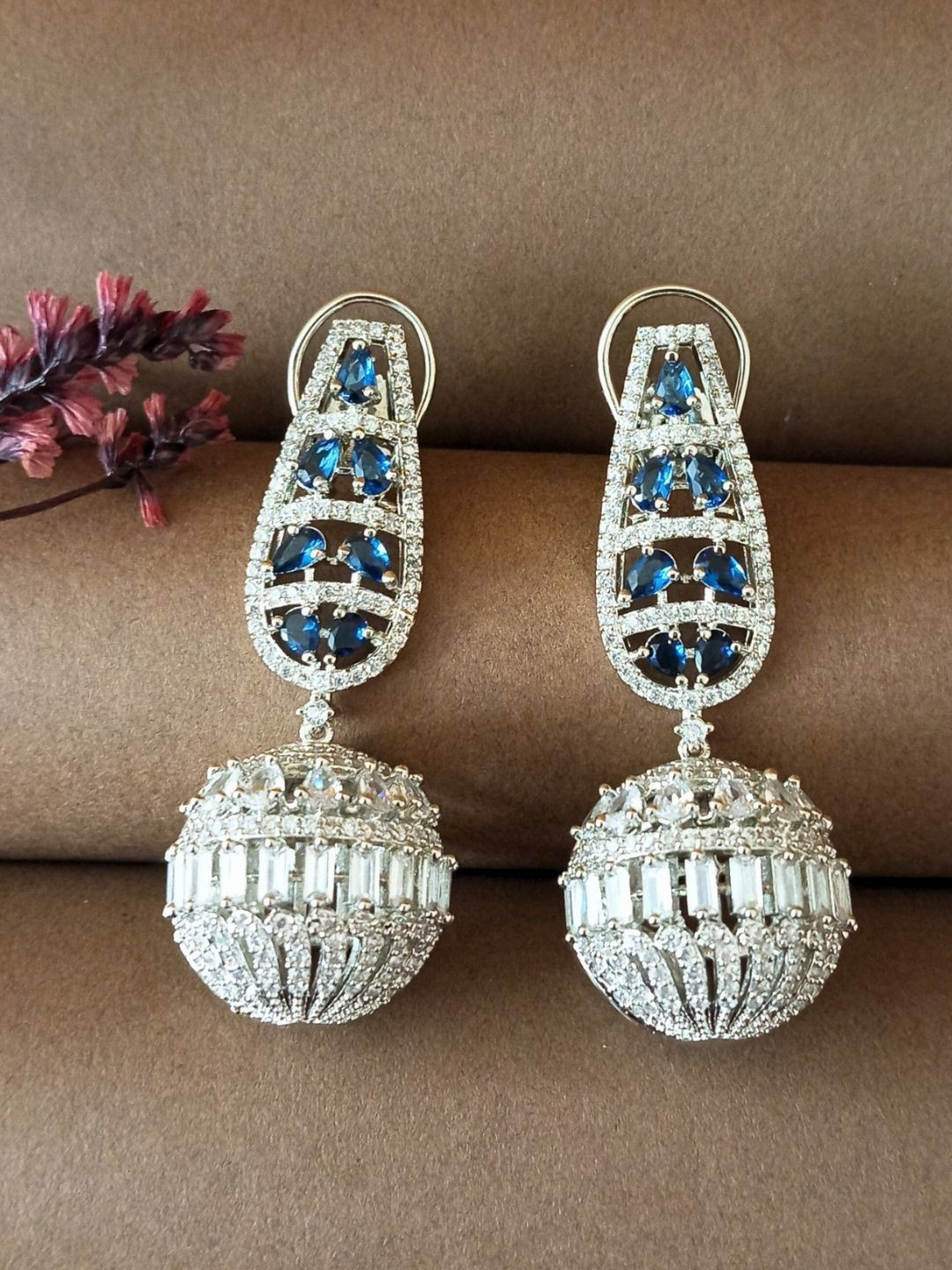 IKSAVA Silver Plated American Diamond Studded Spherical Shaped Drop Earrings