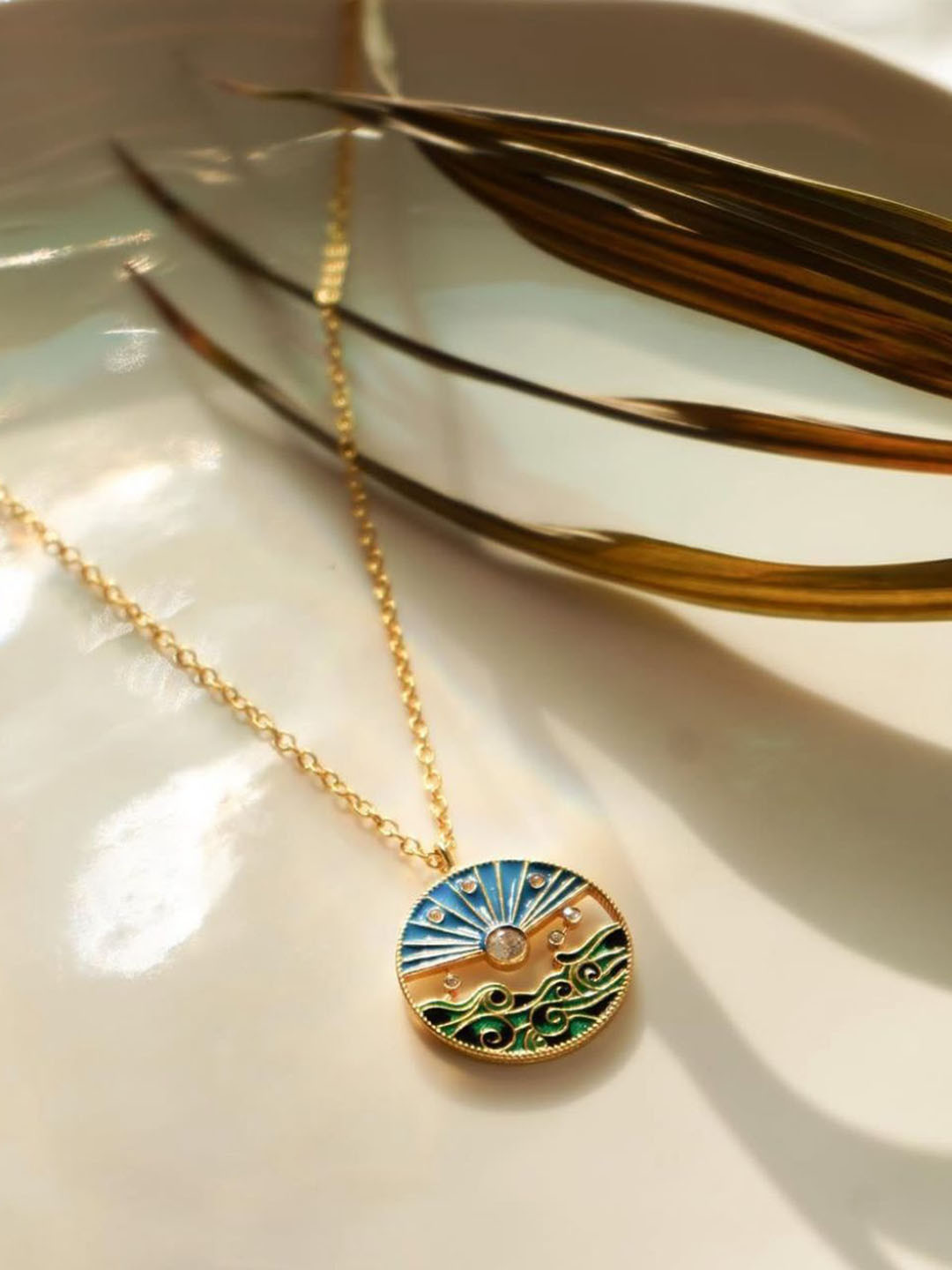 ALSO - A Look to Stand Out Gold-Plated Stones Studded Circular Shaped Pendant With Chain