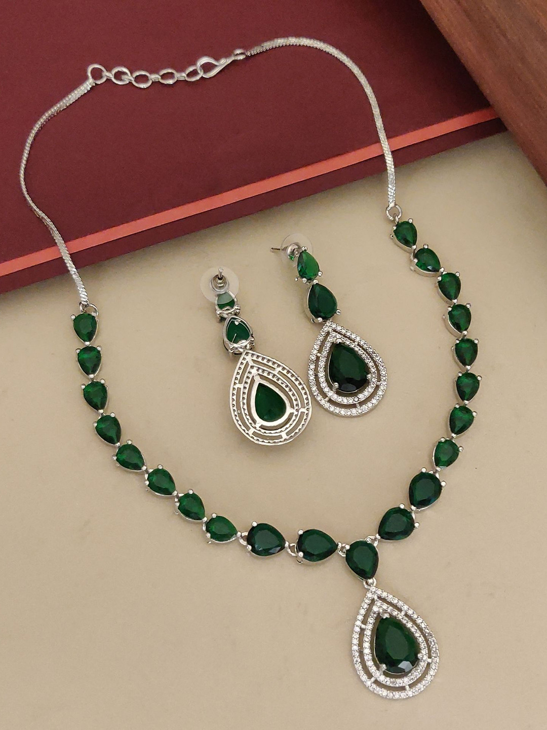 ABDESIGNS Silver-Plated Flower American Diamond Studded Necklace and Earrings