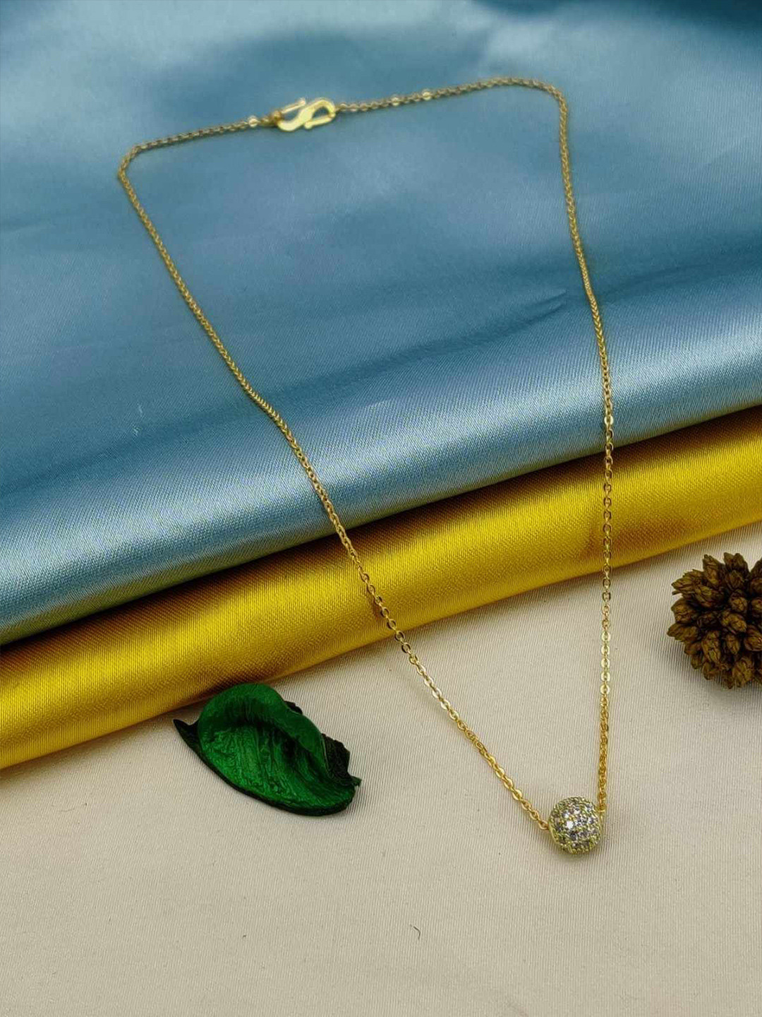 DHARM JEWELS Gold-Plated American Diamond Studded Ball Pendant With Chain