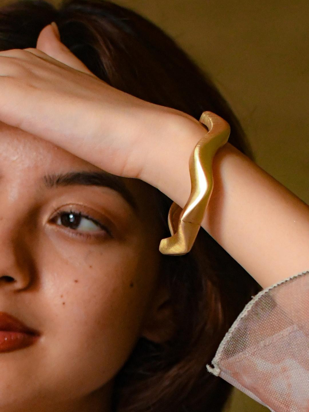 RaasRani Women Matte Gold Sculpted Wave Bangle-Style Bracelet
