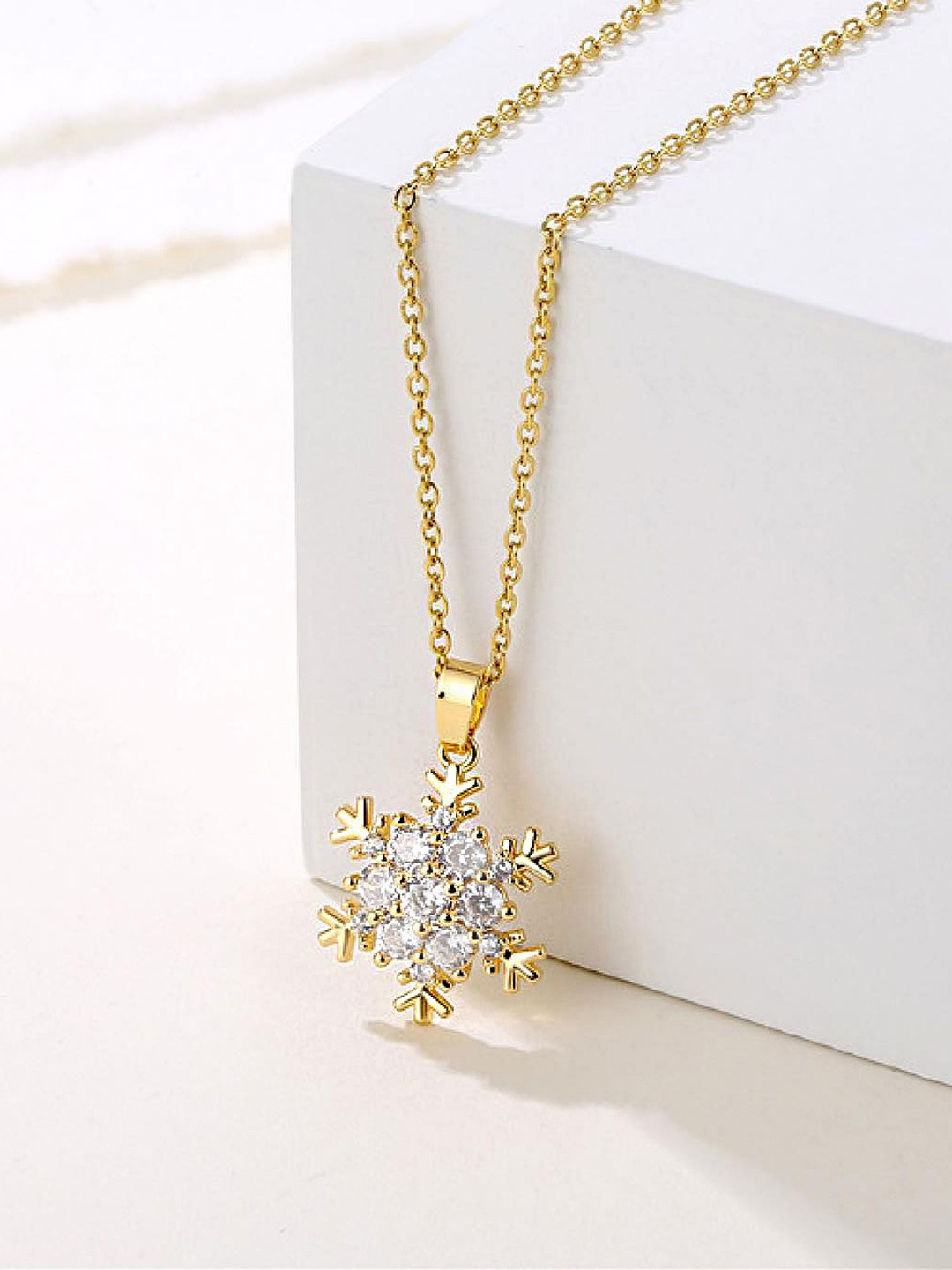 Bohey by KARATCART Gold-Plated American Diamond Studded Snowflake Pendant With Chain