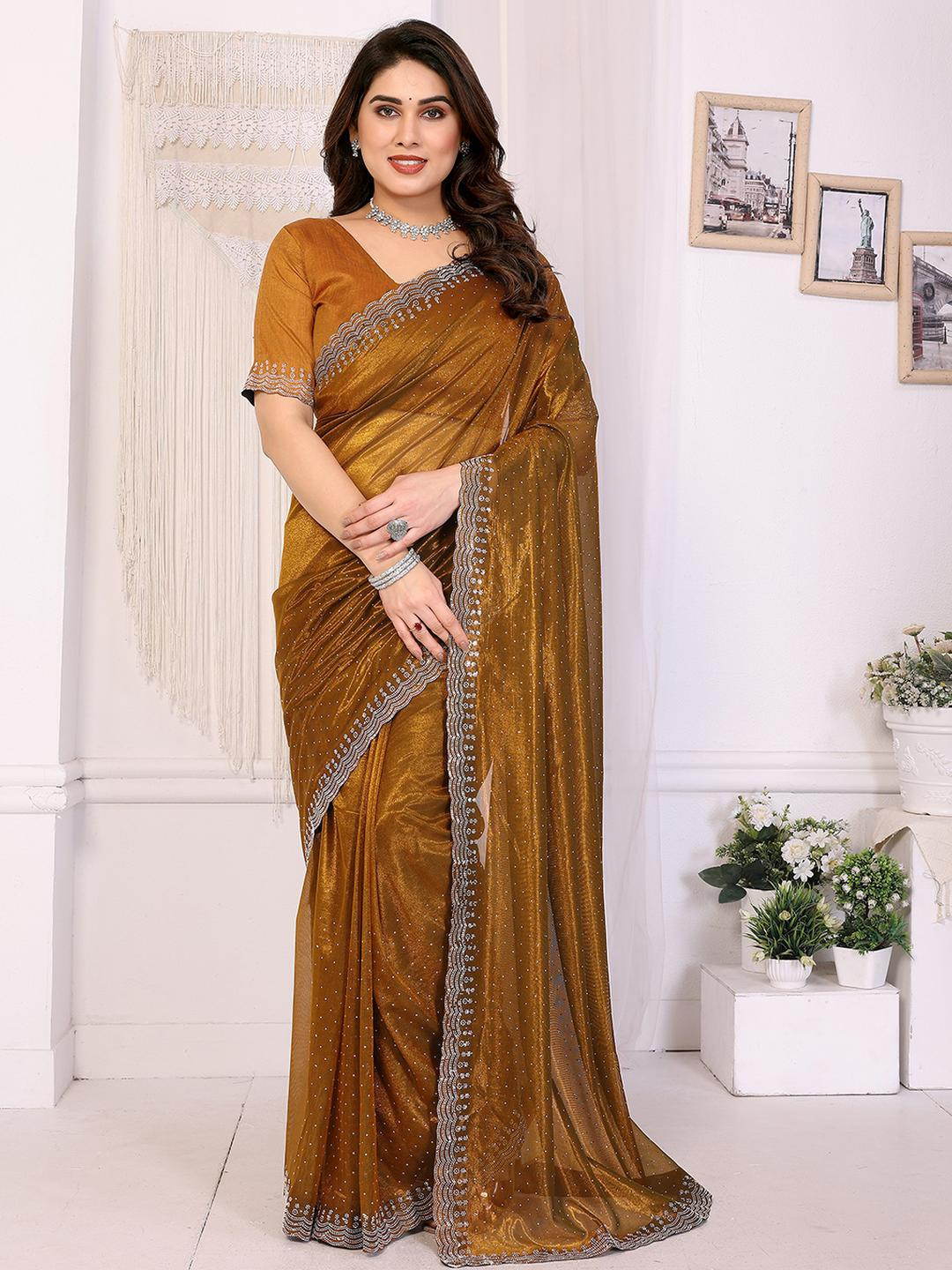 Moda Rapido Brown Embellished Net Sarees