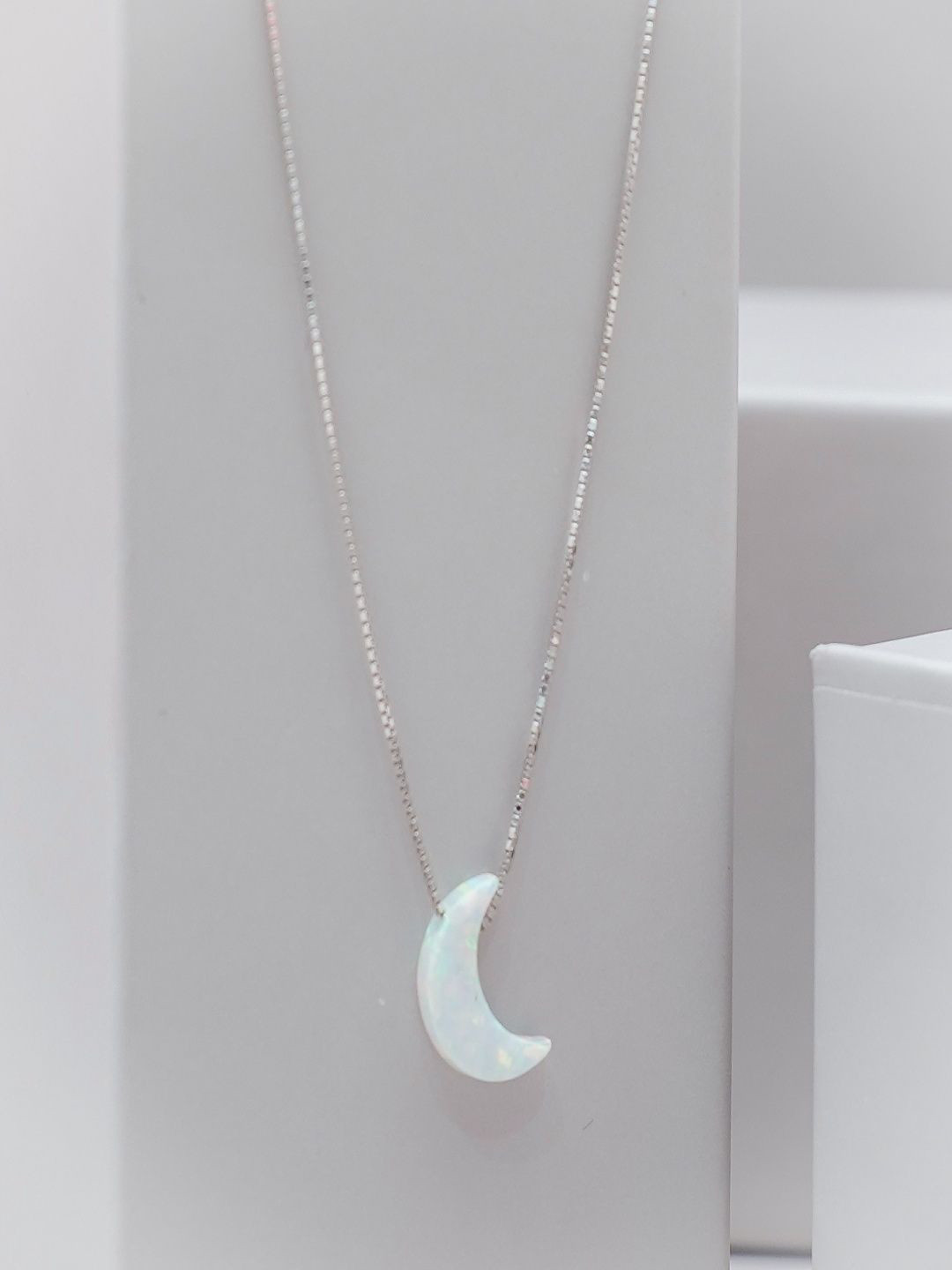 TASSYA Silver-Plated Artificial Stones Studded Moon Shaped Pendant With Chain