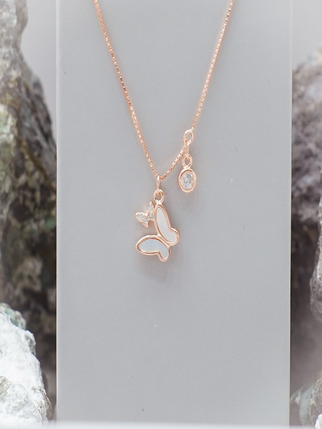 TASSYA Rose Gold-Plated Artificial Stones Studded Butterfly Shaped Pendant With Chain