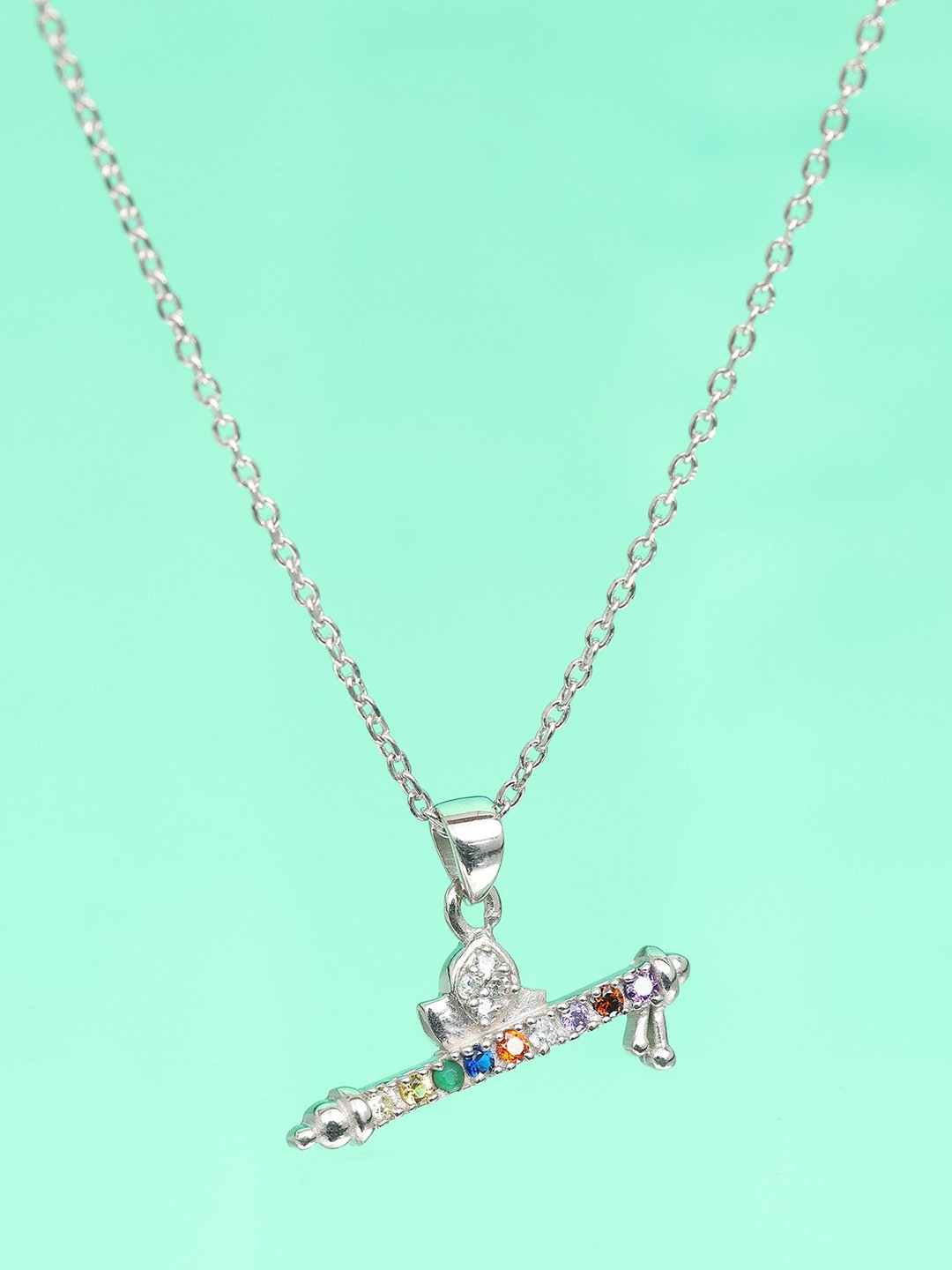 Exotic India Sterling Silver Murli Pendant with Round Shape Multi Gemstone