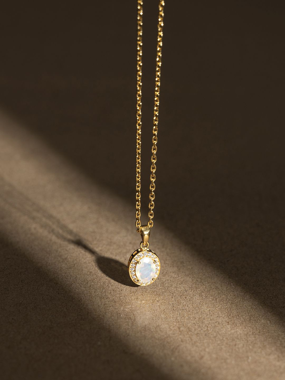 Stone Story By Shruti Stainless Steel Gold-Plated Opal Studded Oval Pendant With Chain