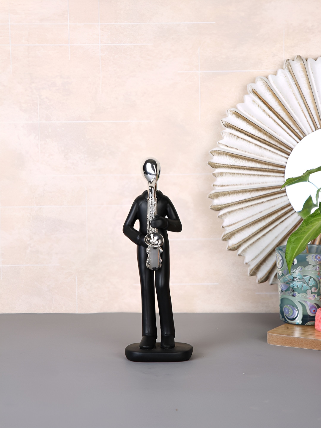 Myntra Elegant Homes Saxophonist Black Polyresin Natural Living Room Small Showpiece - 6.5 Inches